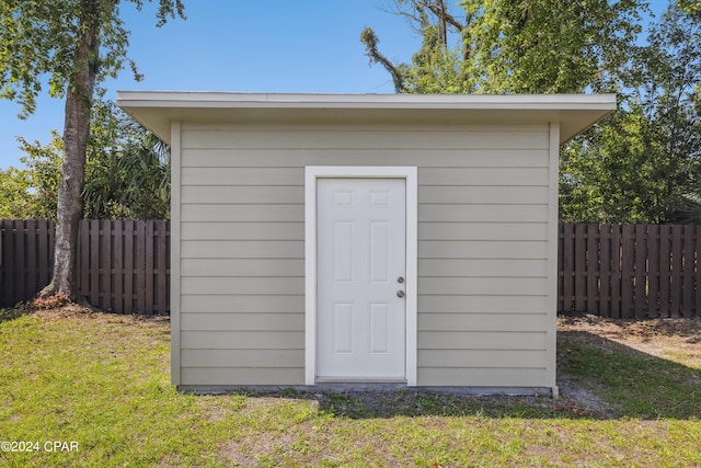 view of shed featuring a fenced backyard