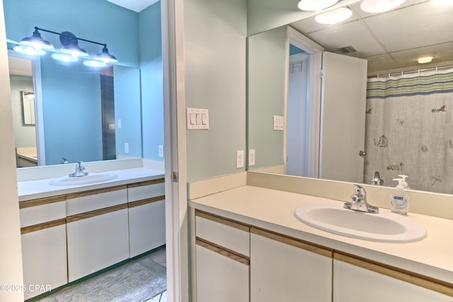 bathroom featuring a shower with shower curtain and vanity