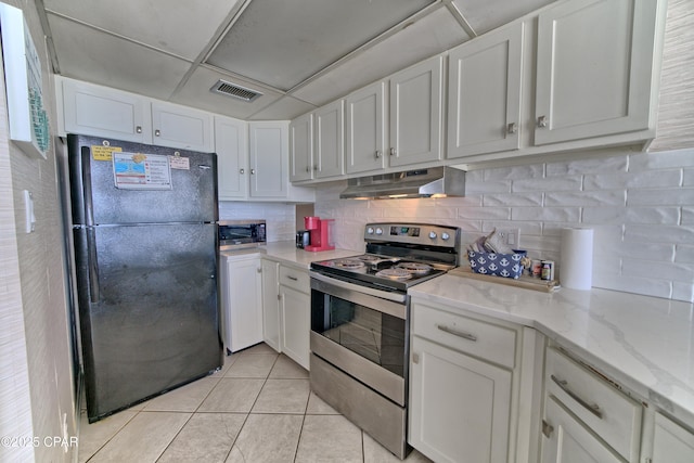 kitchen with light tile patterned floors, visible vents, appliances with stainless steel finishes, white cabinetry, and under cabinet range hood