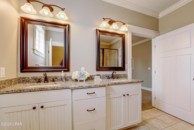 bathroom featuring crown molding, vanity, and tile patterned flooring