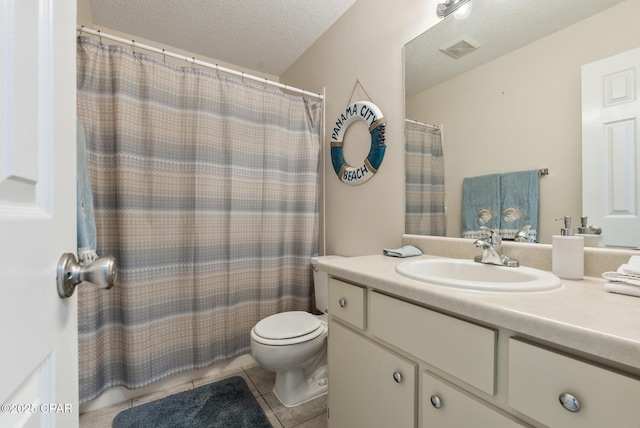 bathroom with vanity, visible vents, a textured ceiling, tile patterned floors, and toilet