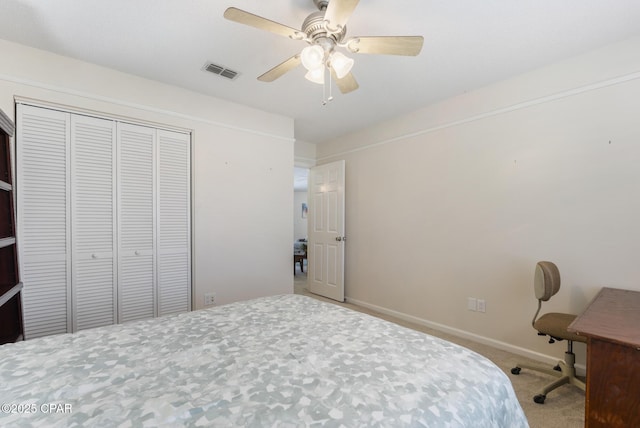 bedroom featuring visible vents, a closet, carpet floors, baseboards, and ceiling fan