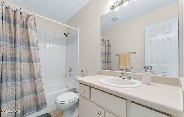 full bathroom with tile patterned floors, visible vents, toilet, a textured ceiling, and vanity