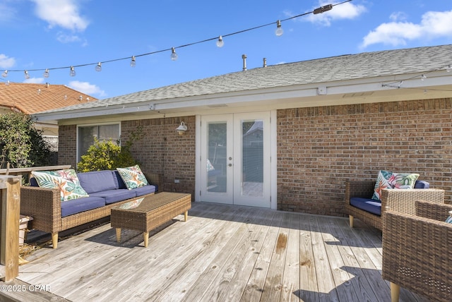 wooden terrace with french doors and an outdoor hangout area