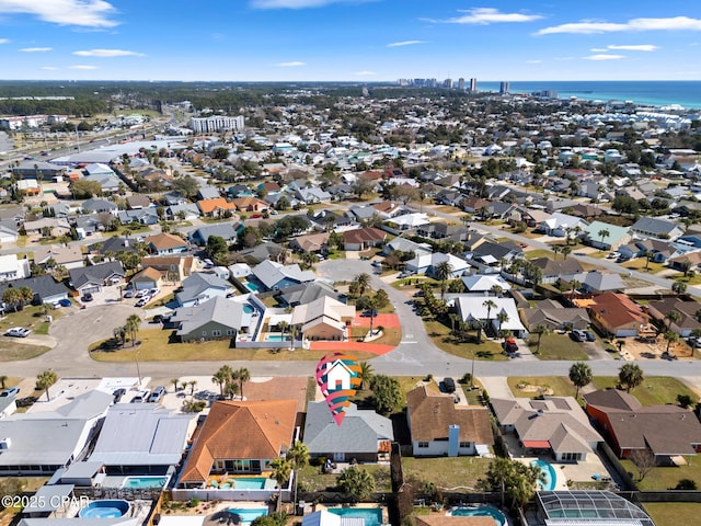 birds eye view of property with a residential view and a water view