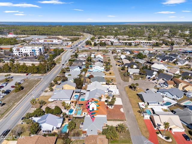 birds eye view of property with a residential view