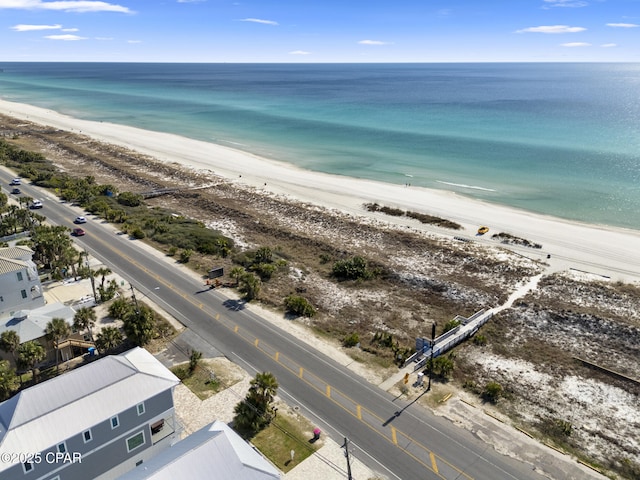 drone / aerial view featuring a view of the beach and a water view