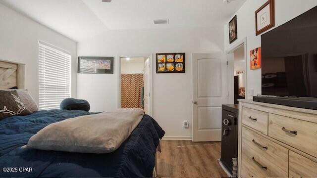 bedroom featuring dark hardwood / wood-style floors