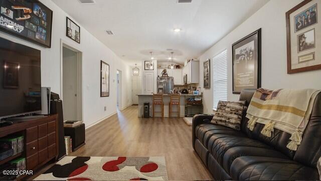 living room featuring light wood-type flooring