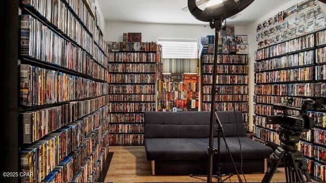 sitting room with wood-type flooring