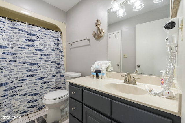 bathroom with tile patterned floors, vanity, toilet, and a shower with shower curtain