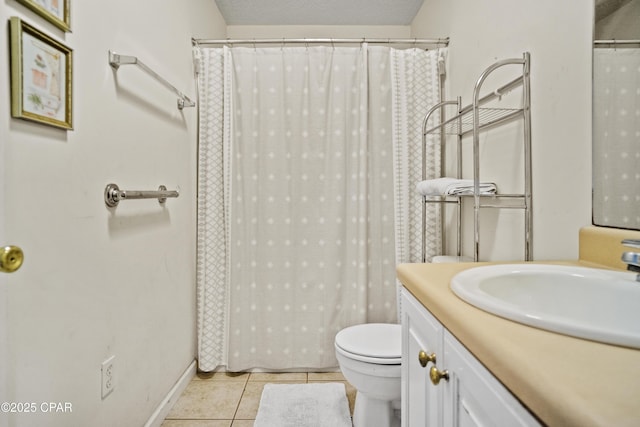 bathroom with vanity, tile patterned floors, a textured ceiling, and toilet