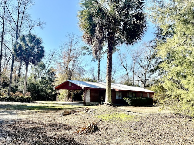 view of front of home with a carport