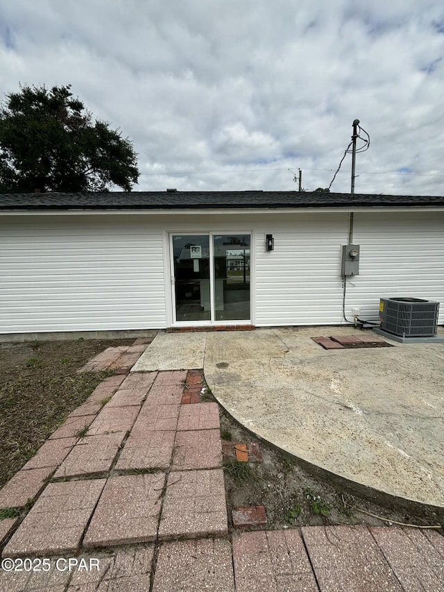 back of house with cooling unit and a patio area