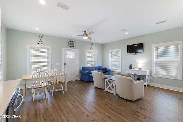 living area with visible vents, recessed lighting, ceiling fan, and dark wood-style flooring