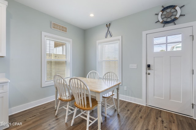 dining room featuring recessed lighting, baseboards, and wood finished floors