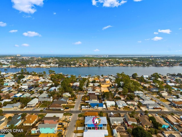 drone / aerial view with a water view and a residential view