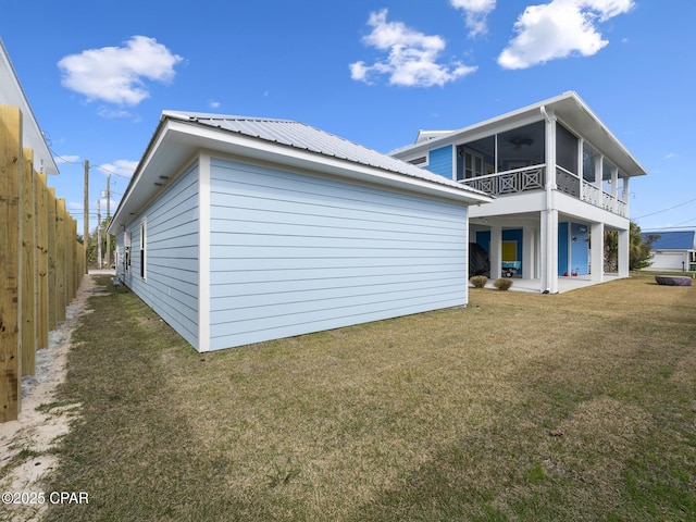 back of property with a patio area, a yard, and fence