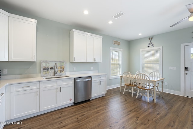 kitchen featuring a sink, visible vents, stainless steel dishwasher, and white cabinetry