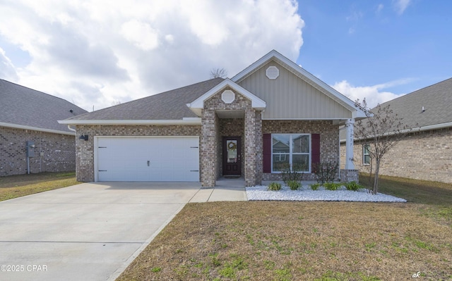 view of front of property featuring a garage and a front yard