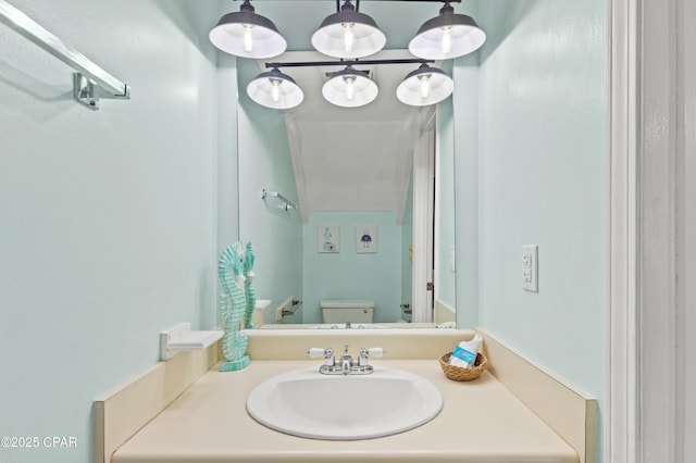 bathroom featuring vanity and toilet