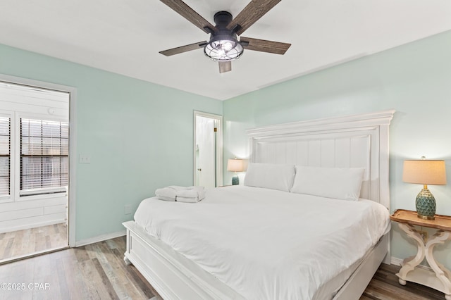 bedroom featuring wood-type flooring and ceiling fan