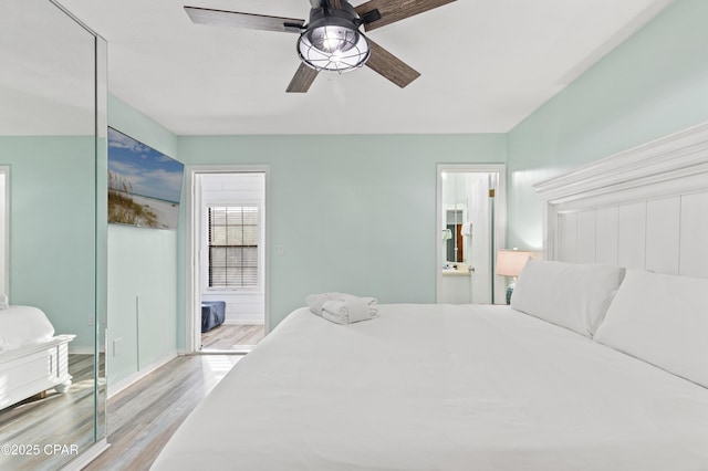 bedroom featuring ceiling fan, connected bathroom, and light hardwood / wood-style flooring