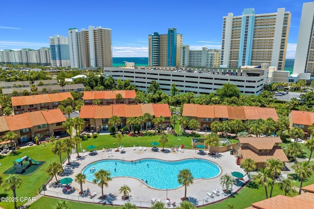 view of pool with a water view