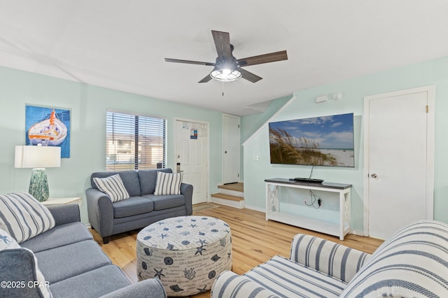 living room with ceiling fan and light hardwood / wood-style floors