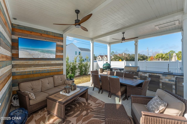 view of patio / terrace featuring an outdoor kitchen, sink, ceiling fan, grilling area, and an outdoor living space