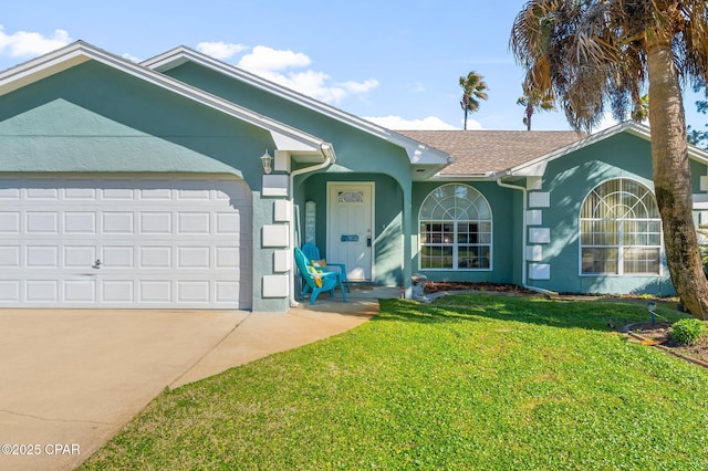 ranch-style house with a garage, concrete driveway, a front lawn, and stucco siding