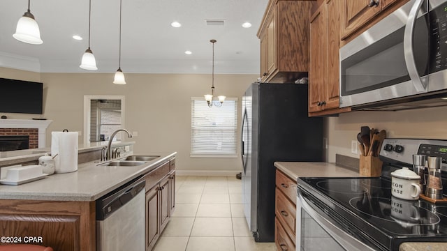 kitchen with crown molding, stainless steel appliances, visible vents, brown cabinetry, and a sink