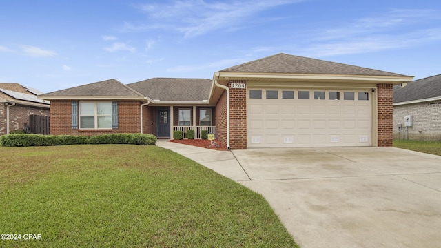 ranch-style house with a garage, concrete driveway, brick siding, and a front lawn