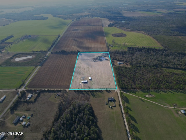 birds eye view of property featuring a rural view