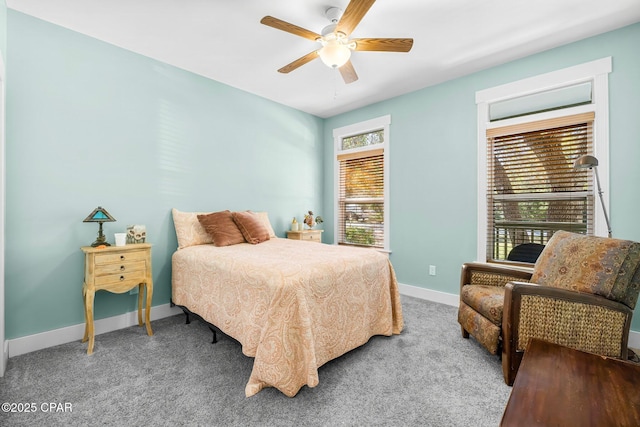 carpeted bedroom featuring a ceiling fan and baseboards