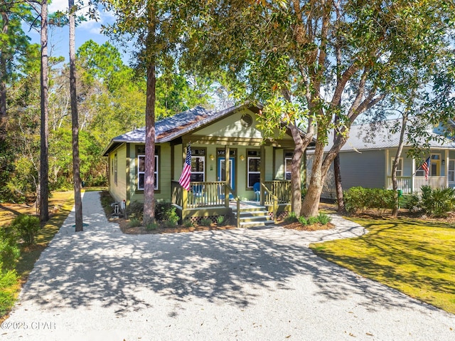 view of front of property featuring covered porch and driveway