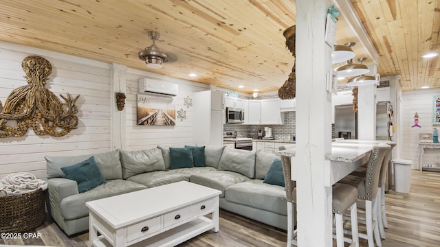 living room with wooden walls, wood ceiling, light wood-style flooring, a wall mounted air conditioner, and recessed lighting