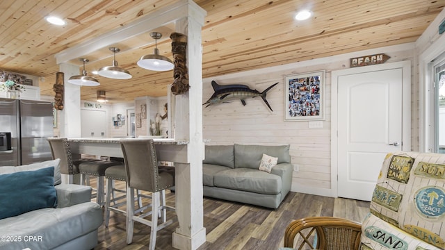 living room with recessed lighting, wood ceiling, wooden walls, and wood finished floors