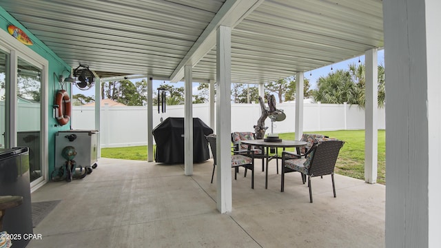 view of patio / terrace featuring outdoor dining area, a fenced backyard, and area for grilling