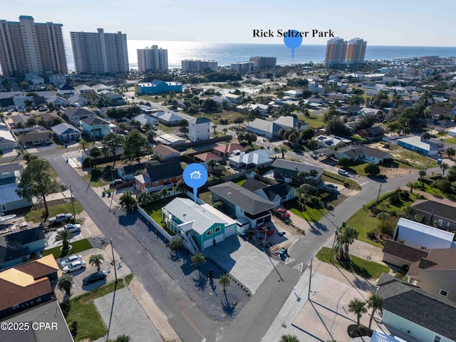 bird's eye view featuring a water view and a city view