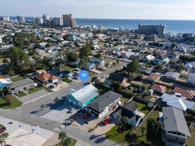 birds eye view of property featuring a view of city and a water view