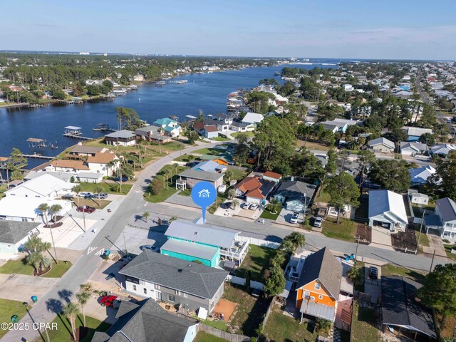 drone / aerial view featuring a water view and a residential view