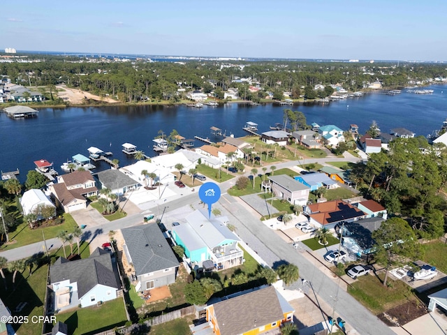 drone / aerial view with a residential view and a water view