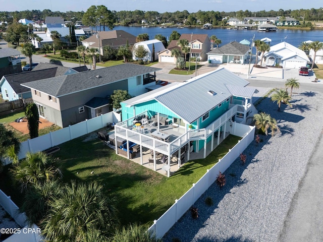 bird's eye view with a water view and a residential view