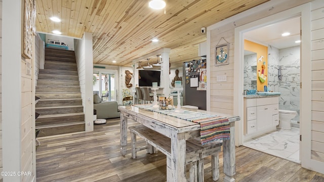 interior space with toilet, wood ceiling, wood finished floors, vanity, and recessed lighting