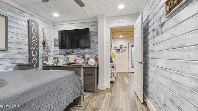 bedroom featuring wood finished floors, a ceiling fan, and recessed lighting