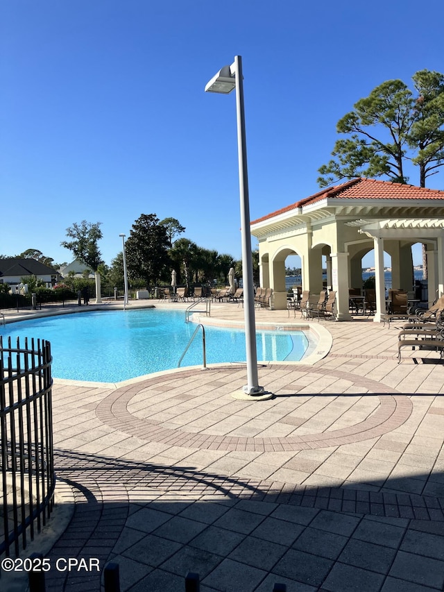 pool featuring a patio area
