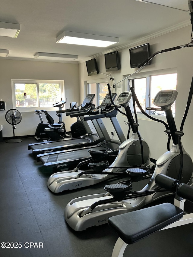 gym featuring crown molding
