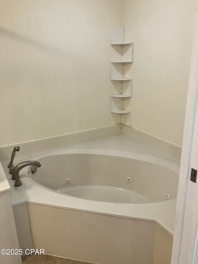 full bath featuring a tub with jets