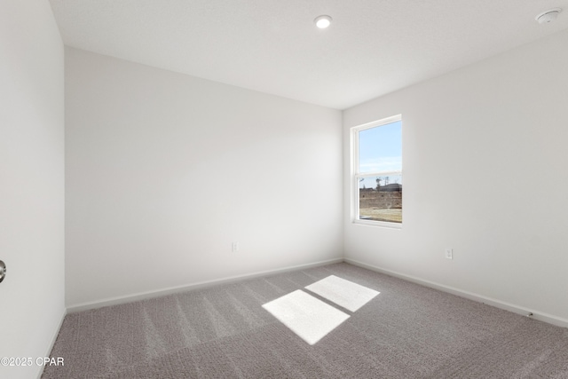 unfurnished room featuring carpet